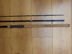 A Cormoran three-piece 13ft match rod IM 10 graphite with cork handle