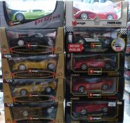 Fourteen Burago 1:18 scale diecast model vehicles some from the Gold Collection (all in original