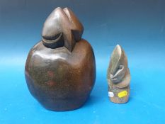 Two carved stone sculptures, one named Bryn T Mteki,