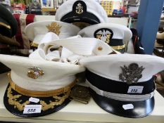 A quantity of US Navy uniform, caps, belts,