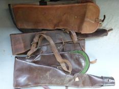 Nine various leather and canvas gun slips