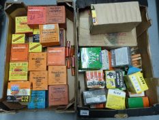 A collection of various shotgun cartridges, mainly 12 bore in vintage wooden box.