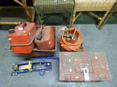 A selection of hand tools, metal petrol cans and a gas bottle with blow torch attached,