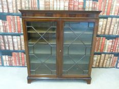 An astragal glazed display cabinet (W97 x D27.