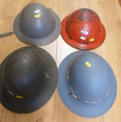 Four various WW2 era helmets including a Plasfort example (possibly munitions)