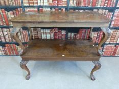 A pair of walnut coffee tables raised on cabriole legs