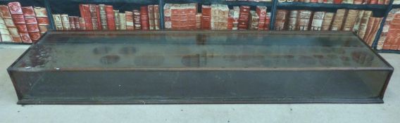 A counter top haberdashery shop or collector's display cabinet with two mirrored drop down doors to