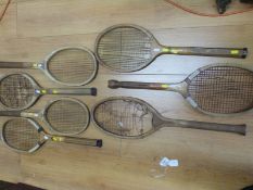 A group of vintage tennis racquets including The Eclipse, Elston King, Park, Octagon,