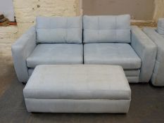A blue suede three-seater sofa and matching ottoman (length 305cm)