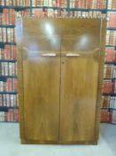 A pair of Art Deco style wardrobes and a matching dressing table