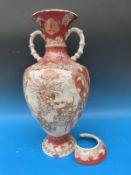 A large oriental vase with decorated panels