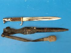 A German Solingen bayonet in sheath with deer antler handle and braided tassel