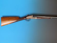 A Zamacola 12 bore side by side shotgun with ornate engraving to the locks and trigger guard two