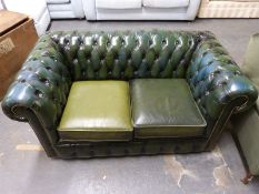 A green leather two-seat Chesterfield sofa (length 153cm)