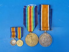 A WWI pair of medals with cased miniatures awarded to 27335 Pte E A Sharp,