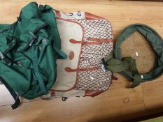 A large canvas and leather fishing bag,