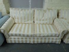 A pair of bespoke gold and cream sofas with goose down cushions,