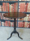 An 18th/19thC mahogany tilt top table raised on slender tripod base,