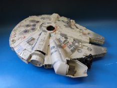 A Star Wars Millennium Falcon toy and various Star War figures by LFC