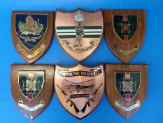 Six Rhodesian military plaques including The Trooper, Rhodesia Regiment 5th Battalion,