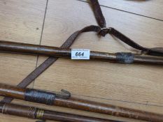 Four vintage salmon fishing gaffs one with telescopic brass shaft stamped made in Great Britain,