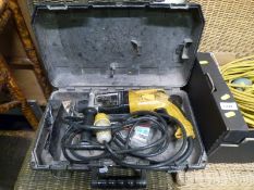 A cased Dewalt power drill together with a 110 volt transformer unit,