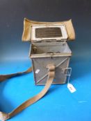 A WWII signalling lamp, daylight short range, complete with coloured lenses, inspection lamp,