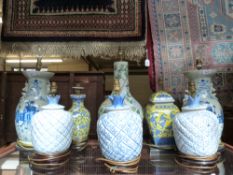 A collection of eight decorative Chinese ceramic lamps