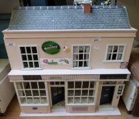 A dolls house with shop front