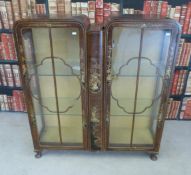 A Japanese-style lacquered display cabinet raised on cabriole legs (W106 x D33 x H117cm)