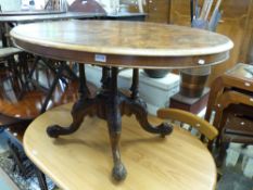 A Victorian walnut breakfast table with four scrolling carved legs and pillar supports (maximum