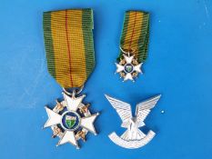 A Rhodesian Member of the Legion of Merit Medal and Selous Scouts cap badge.