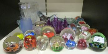 A collection of glass paper weights including Caithness together with other glass items