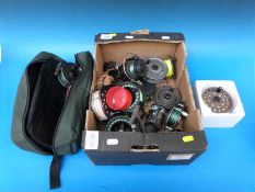 A box of seven trout fishing reels include a Bob Church Viking example, multiple spare spools,