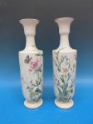 A pair of hand painted glass vases.
