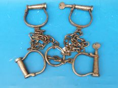 A leg iron and handcuff shackle set thought to be European,