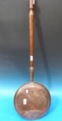 A copper warming pan