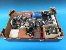 Twenty-six various fishing reels and spools to include Hardy, Leeda Rimfly Magnum,