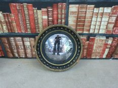 A 19thC ebonised and gilt studwork convex circular wall mirror with original glass and pine back