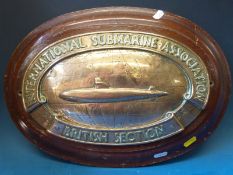 A bronze International Submarine Association British Section oval plaque on wooden base (maximum