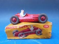 Three Dinky Toys diecast model racing cars, Maserati 231, Ferrari 234 and H.W.