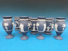Eleven Wedgwood Jasper ware vases in dark blue