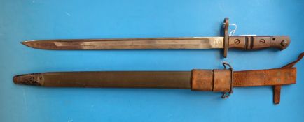 A 1917 Remington bayonet with leather scabbard