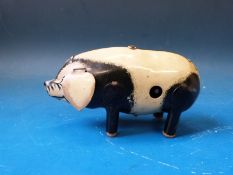 A tin plate toy pig with clockwork mechanism and key