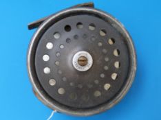 A  fishing reel with brass foot by J S Sharpe,