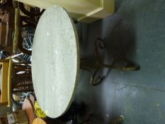 A marble-topped garden table with scrolling base