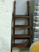 A mahogany folding library step ladder