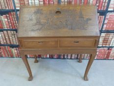 A carved Chinese bureau,