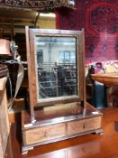 A Georgian swing frame mirror with two drawers below (width 47cm)