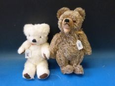 A Merrythought bear with jointed limbs (32cm tall) together with another similar mohair bear with